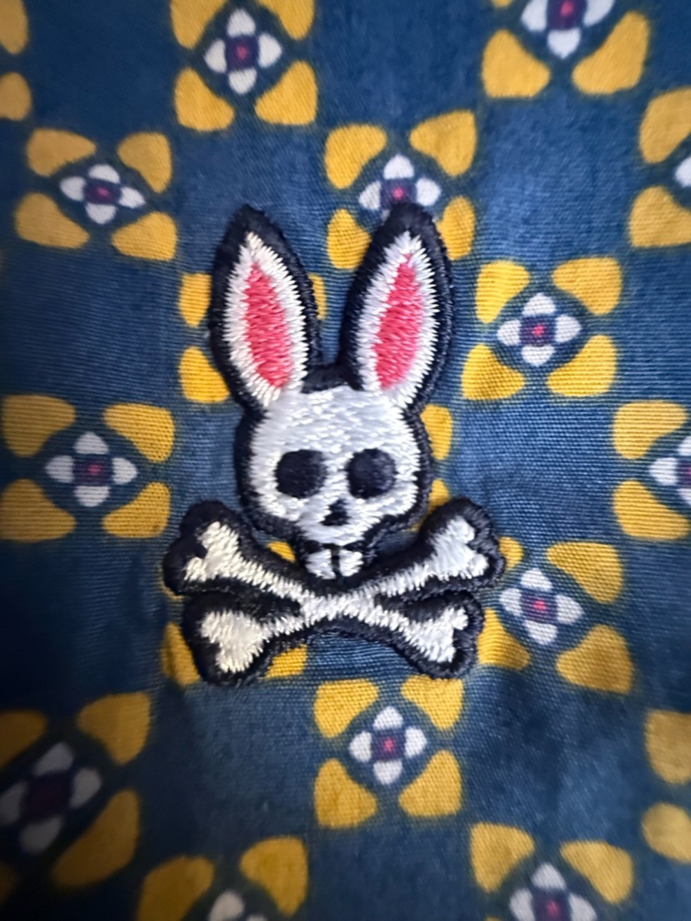 Psycho Bunny Blue Shirt with Yellow Floral Trim